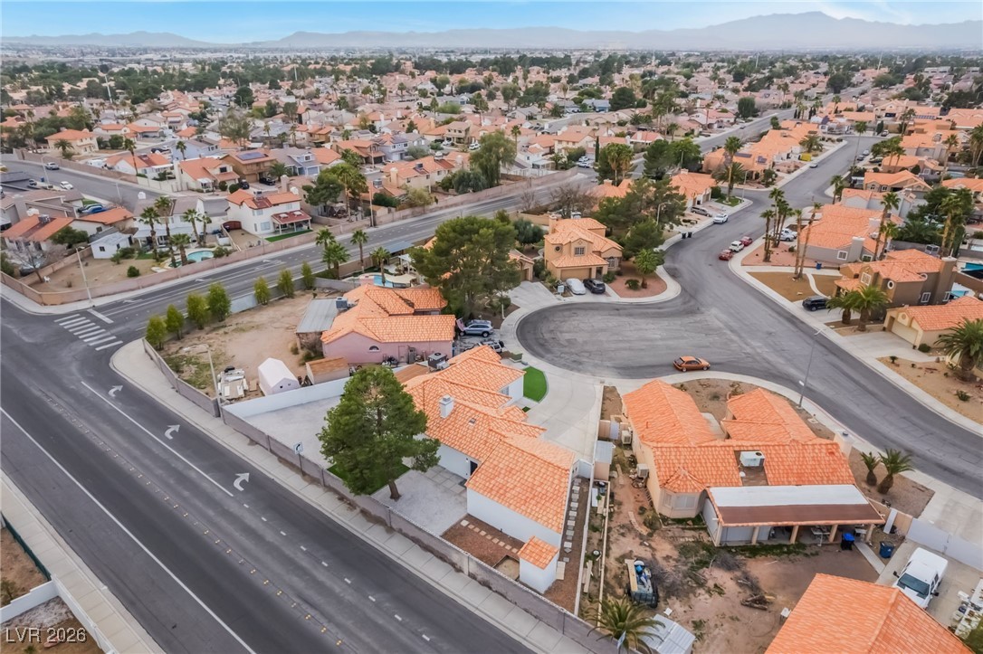 2850 Nikki Place Henderson, NV 89074 - Photo 61 of 64 Aerial view of property and surrounding area with nearby suburban area and a mountainous background