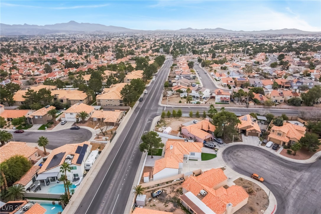 2850 Nikki Place Henderson, NV 89074 - Photo 62 of 64 Aerial view of property's location with a mountainous background and nearby suburban area
