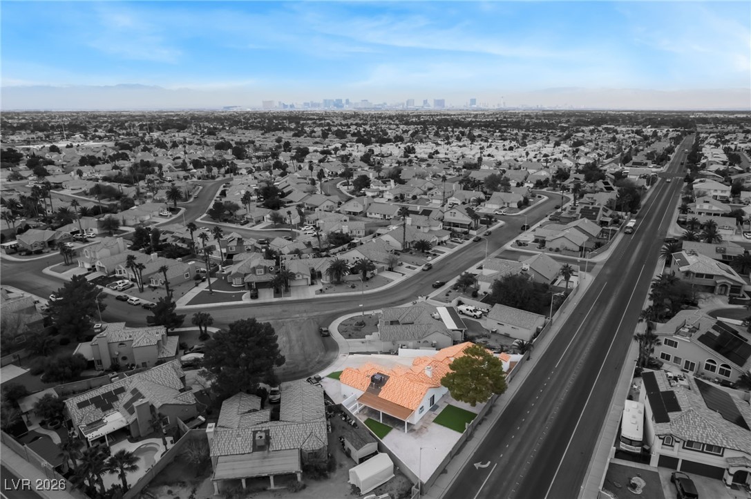 2850 Nikki Place Henderson, NV 89074 - Photo 63 of 64 Aerial perspective of suburban area with city skyline