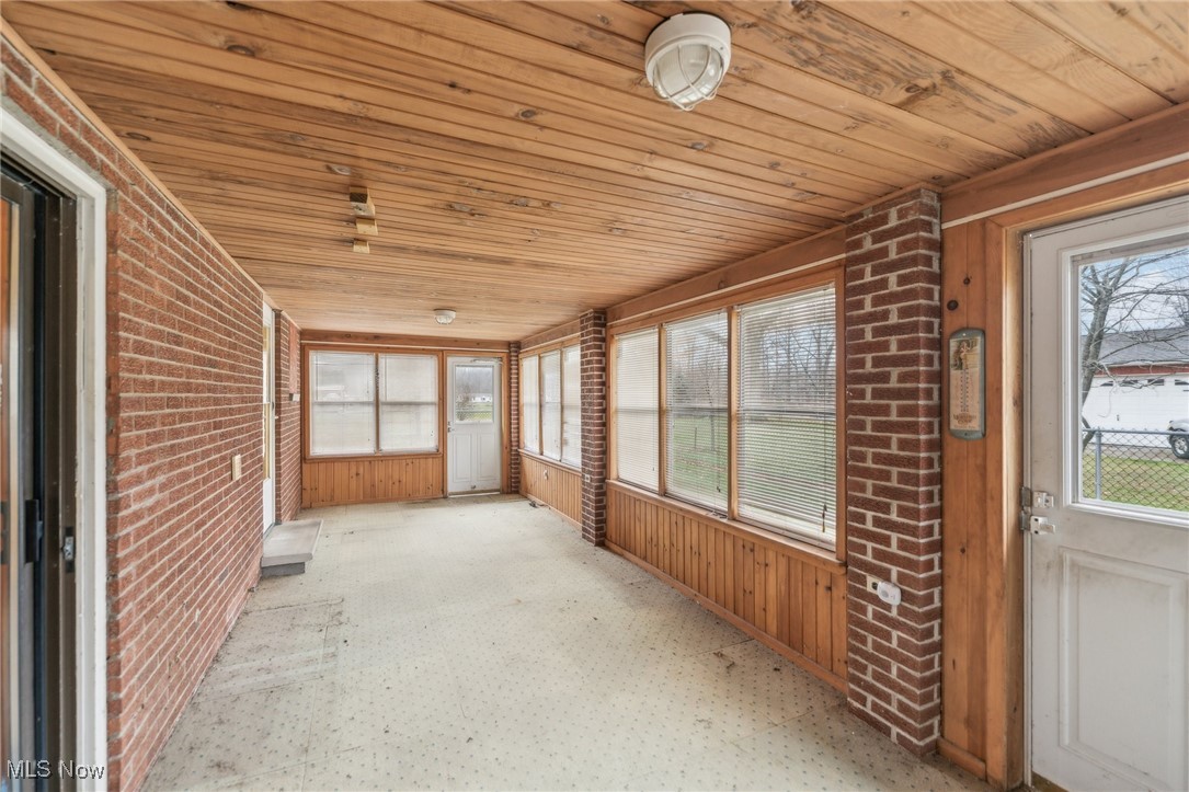 6326 Murray Ridge Road Elyria, OH 44035 - Photo 40 of 49 Unfurnished sunroom featuring wood ceiling