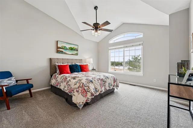 a bedroom with a bed dresser and a window