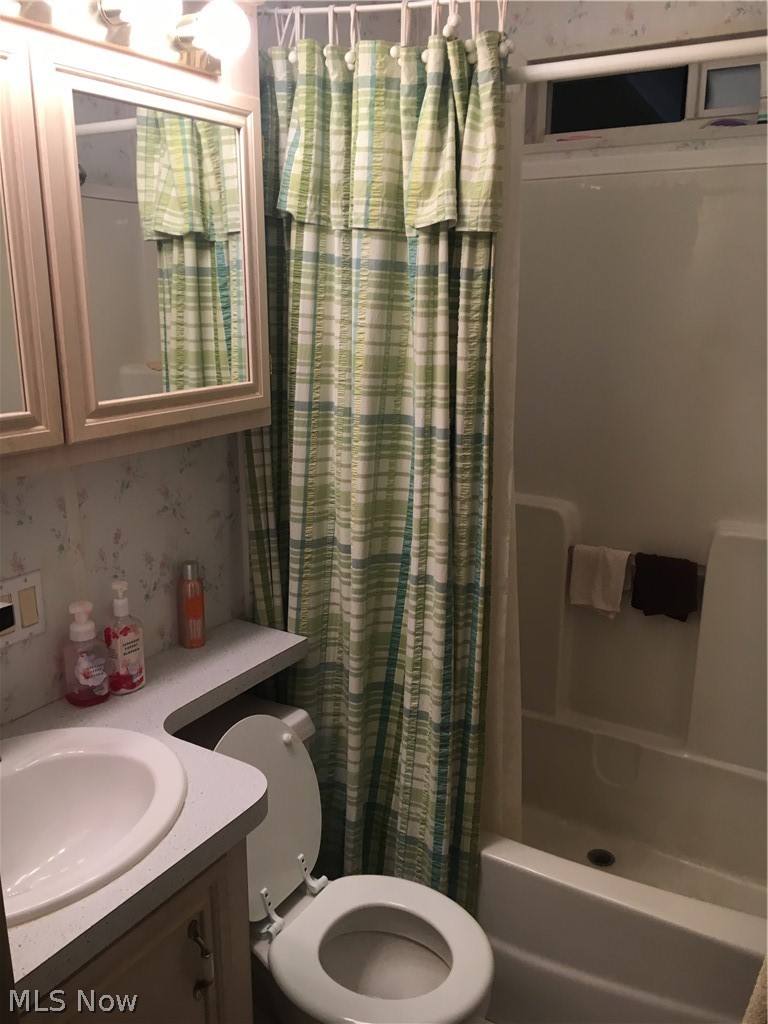 17875 Lashley Road, Unit 403 Senecaville, OH 43780 - Photo 13 of 22 Full bathroom with shower / bath combo, vanity, and toilet