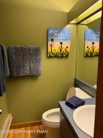 a bathroom with a toilet and a sink