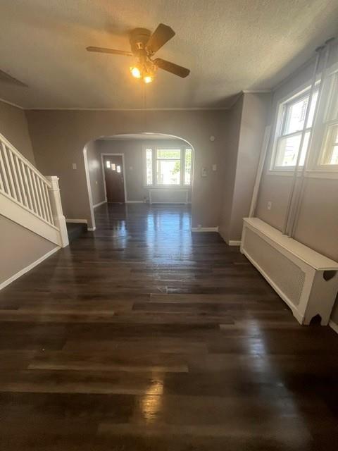 126 East High Street Coaldale, PA 18218 - Photo 5 of 15 Rich hardwood floors flow through an inviting living area with a bright window.
