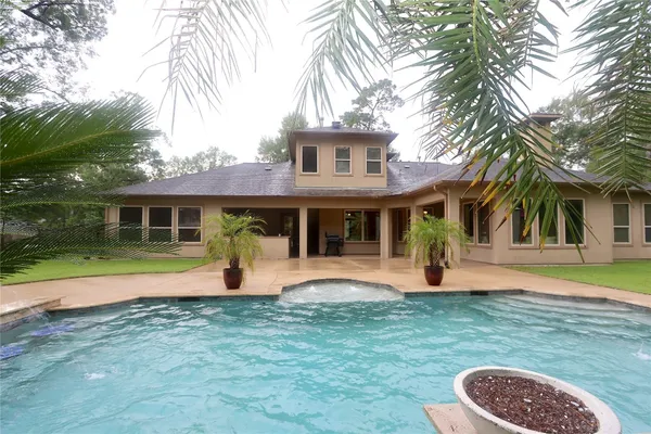a front view of a house with a yard and porch