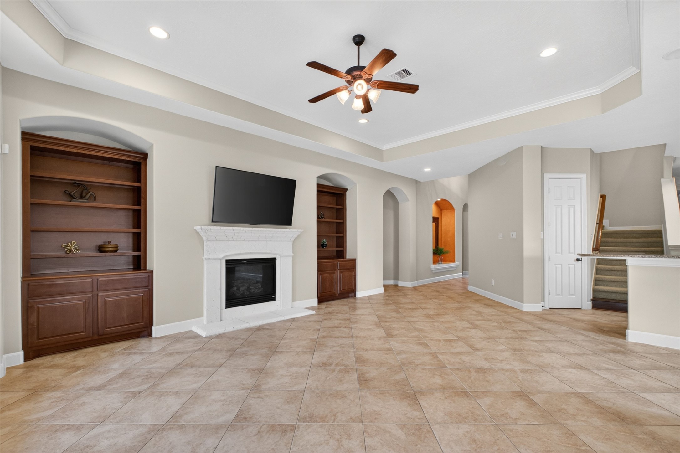 7303 Starry Night Katy, TX 77494 - Photo 9 of 42 Family room open to the kitchen with nice views of the backyard oasis.