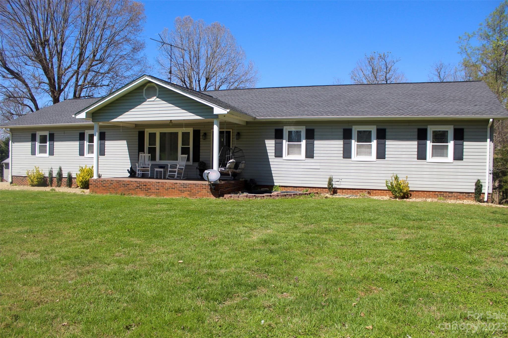 893 Poole Gooden Road Hiddenite, NC 28636 - Photo 4 of 38 a front view of a house with a yard