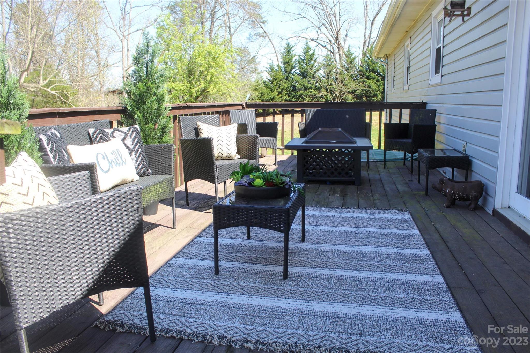 893 Poole Gooden Road Hiddenite, NC 28636 - Photo 9 of 38 a patio view with table and chairs potted plants with wooden floor