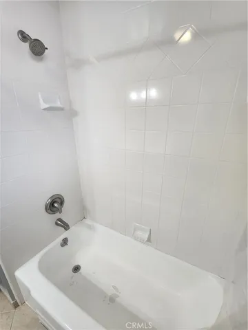 a white bath tub sitting in a bathroom