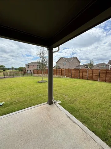 a view of a field with an ocean view