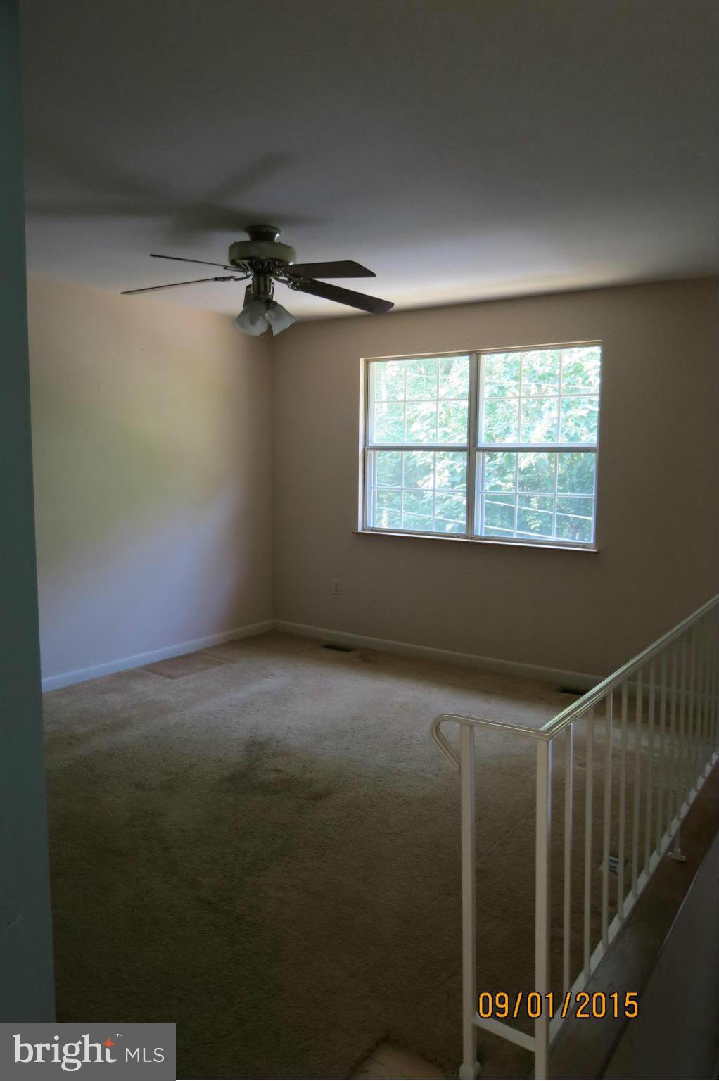 6056 Locust Road St. Leonard, MD 20685 - Photo 5 of 10 a view of an empty room with a window