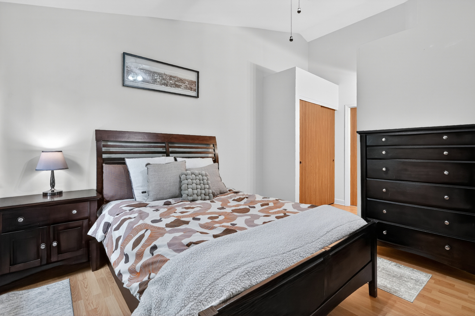 943 Ridgefield Lane, Unit 4 Wheeling, IL 60090 - Photo 16 of 38 a bedroom with a bed and a night stand