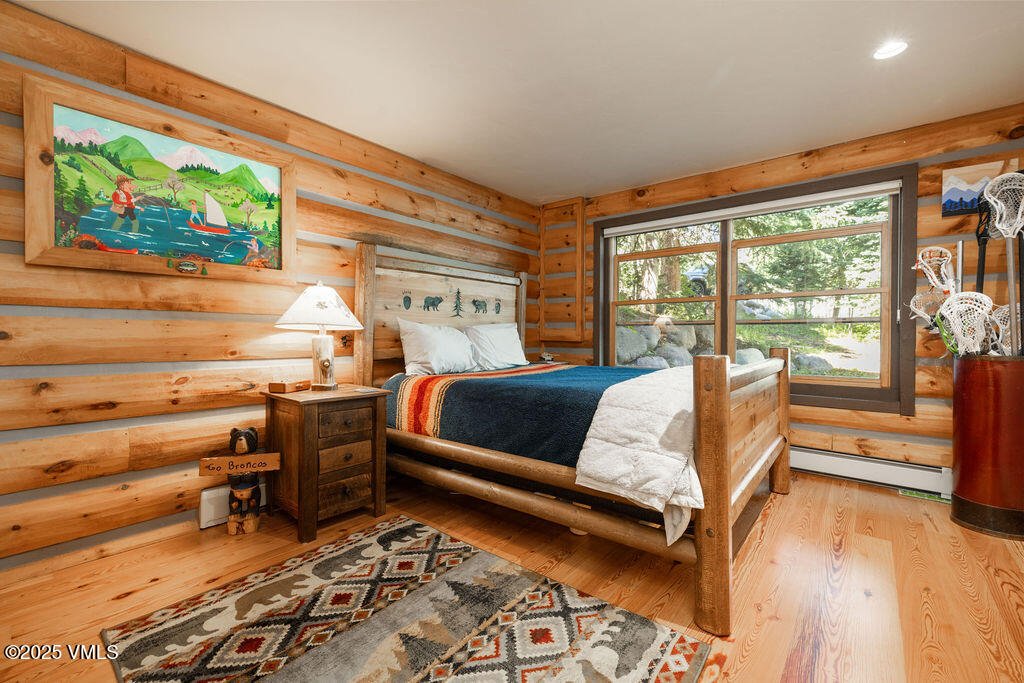 4454 Bellyache Ridge Road Wolcott, CO 81655 - Photo 17 of 48 a bed room with a bed and a large window