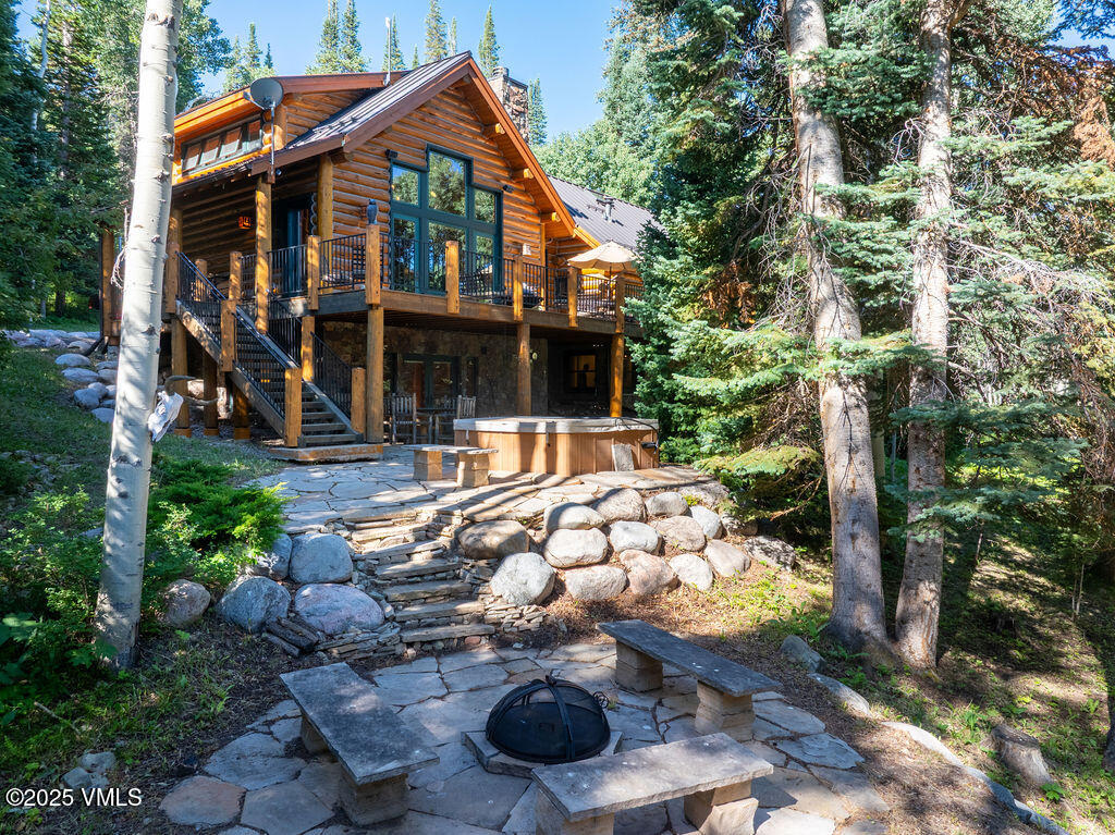 4454 Bellyache Ridge Road Wolcott, CO 81655 - Photo 2 of 48 a backyard of a house with yard and outdoor seating