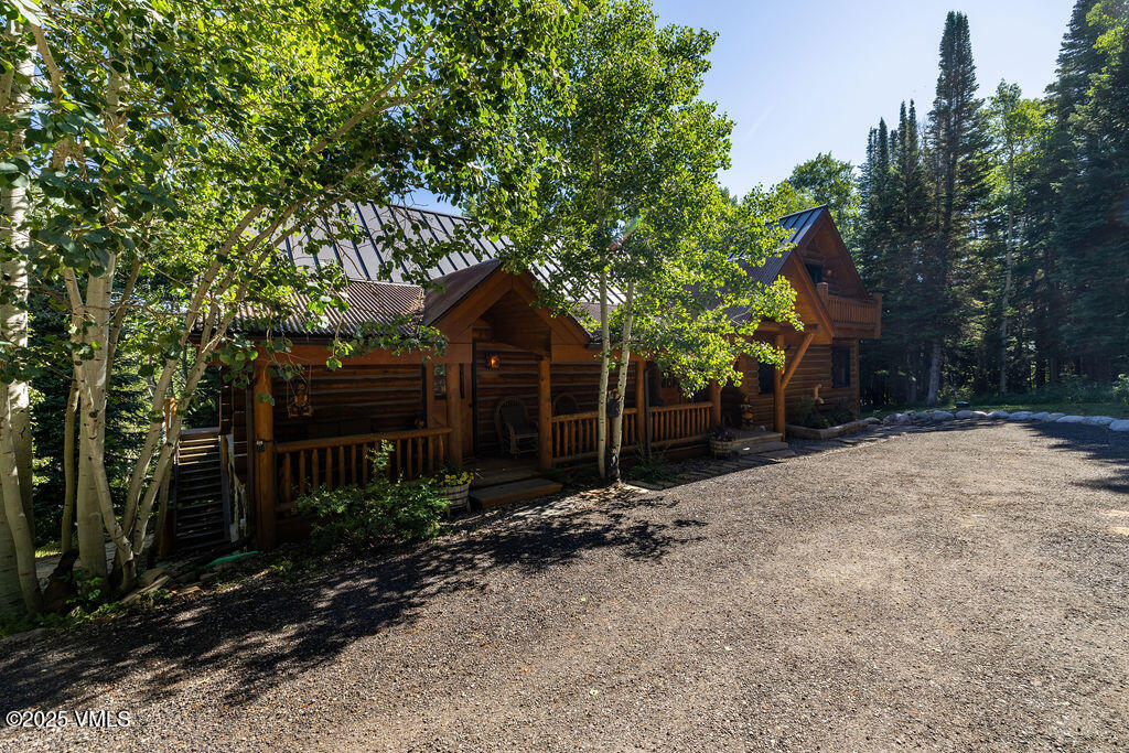 4454 Bellyache Ridge Road Wolcott, CO 81655 - Photo 36 of 48 a front view of a house with a yard