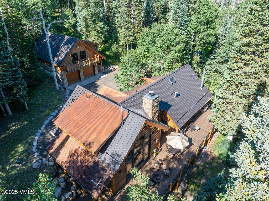 4454 Bellyache Ridge Road Wolcott, CO 81655 - Photo 43 of 48 an aerial view of a house with a yard and trees