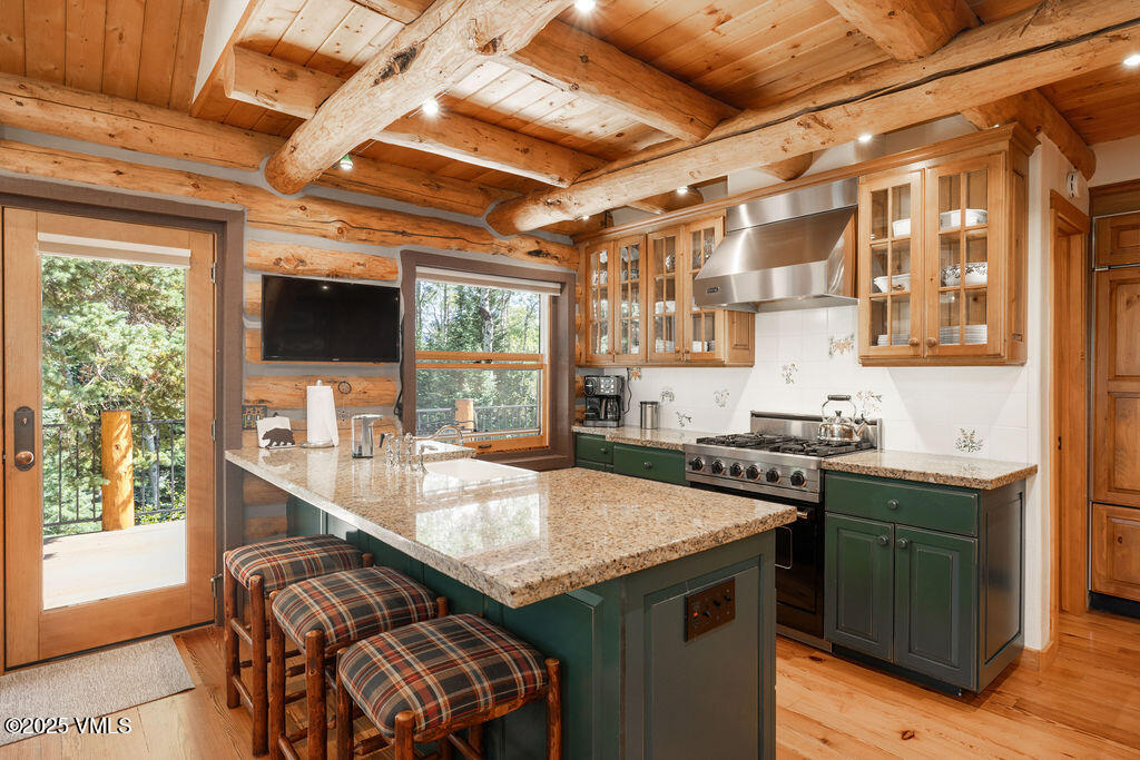 4454 Bellyache Ridge Road Wolcott, CO 81655 - Photo 9 of 48 a kitchen with a sink and wooden cabinets