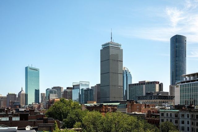 a view of a city with tall buildings