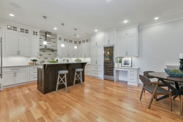 a kitchen with kitchen island a cabinets and a counter top space