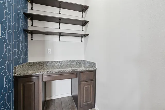 a stove top oven sitting inside of a kitchen