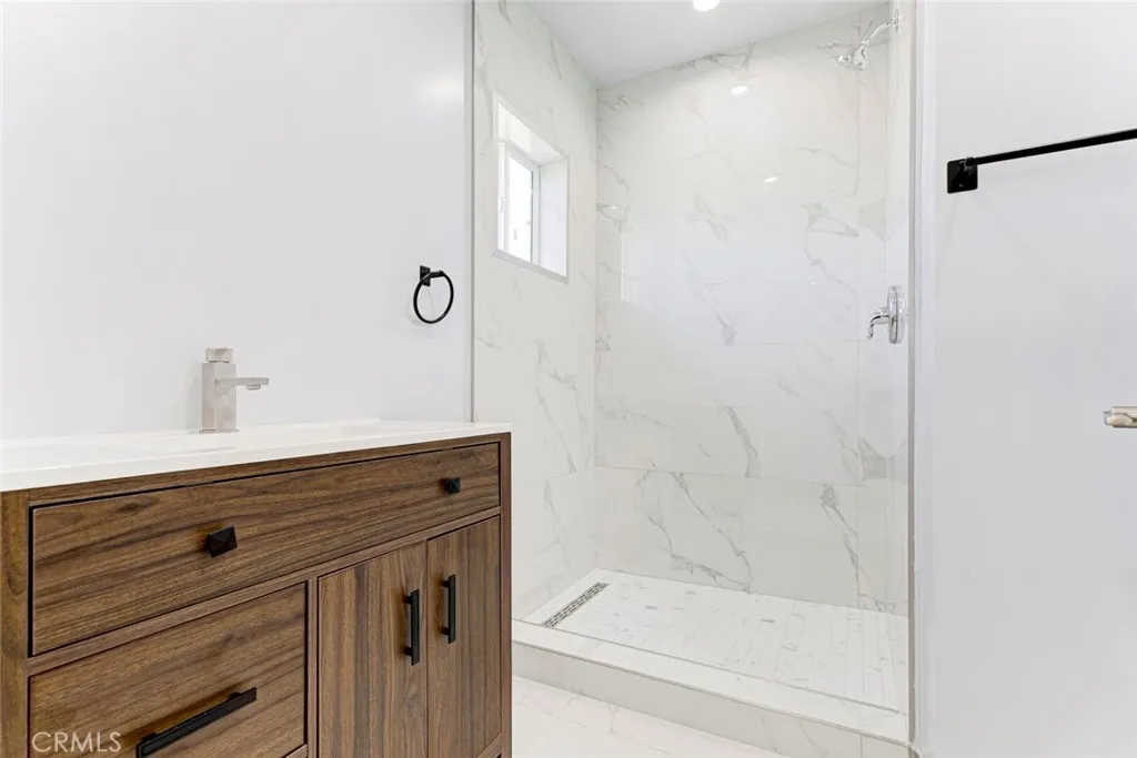 7044 Greeley Street, Unit 3 Tujunga, CA 91042 - Photo 15 of 16 a bathroom with a shower and vanity