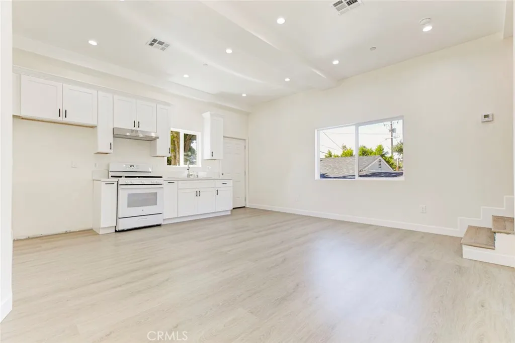 7044 Greeley Street, Unit 3 Tujunga, CA 91042 - Photo 4 of 16 a view of kitchen with wooden floor