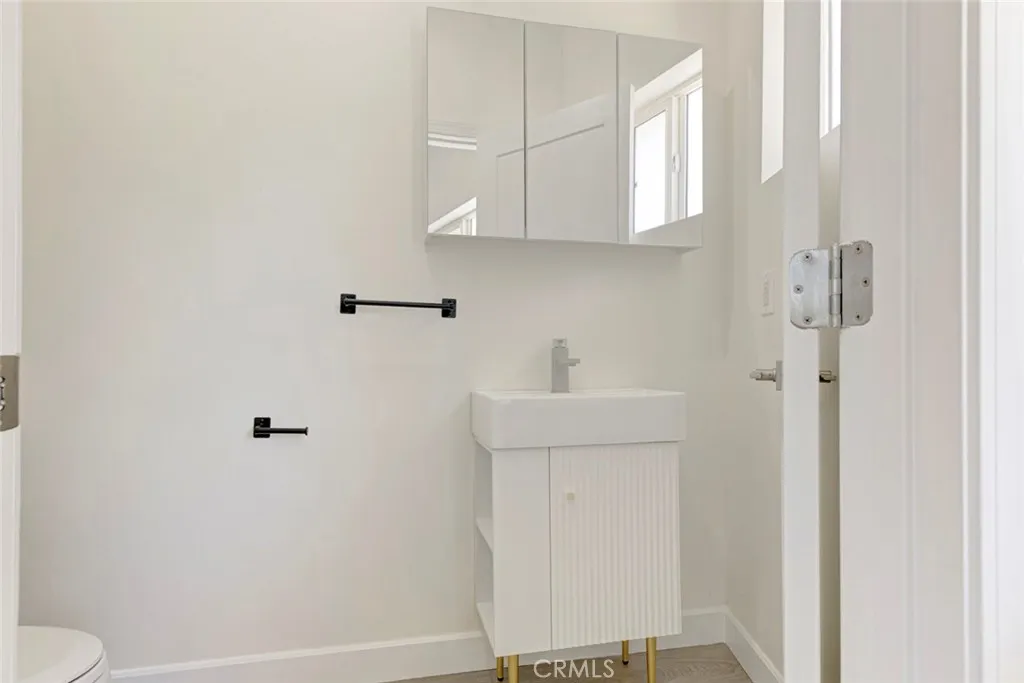7044 Greeley Street, Unit 3 Tujunga, CA 91042 - Photo 6 of 16 a bathroom with a sink a toilet and shower