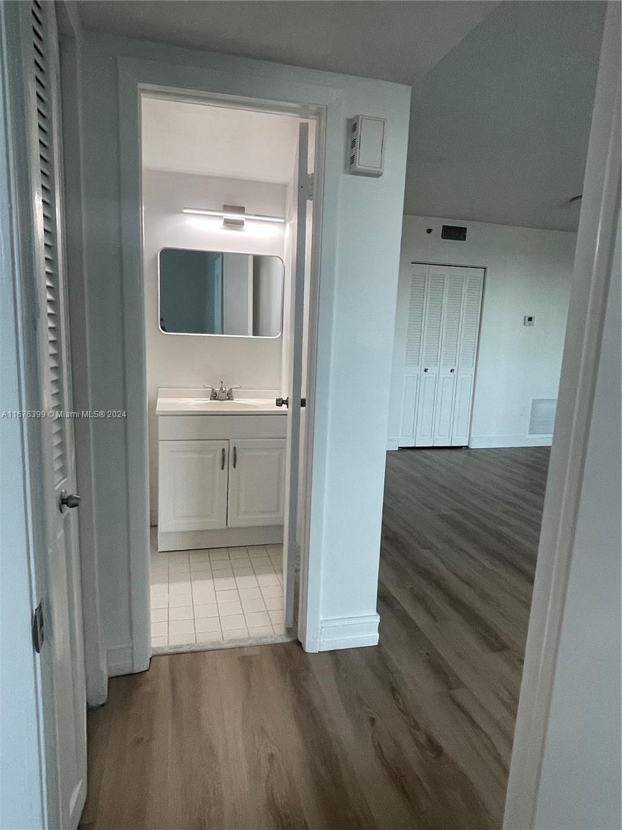 Hillcrest Hollywood, FL 33021 - Photo 11 of 37 a view of a hallway and wooden floor