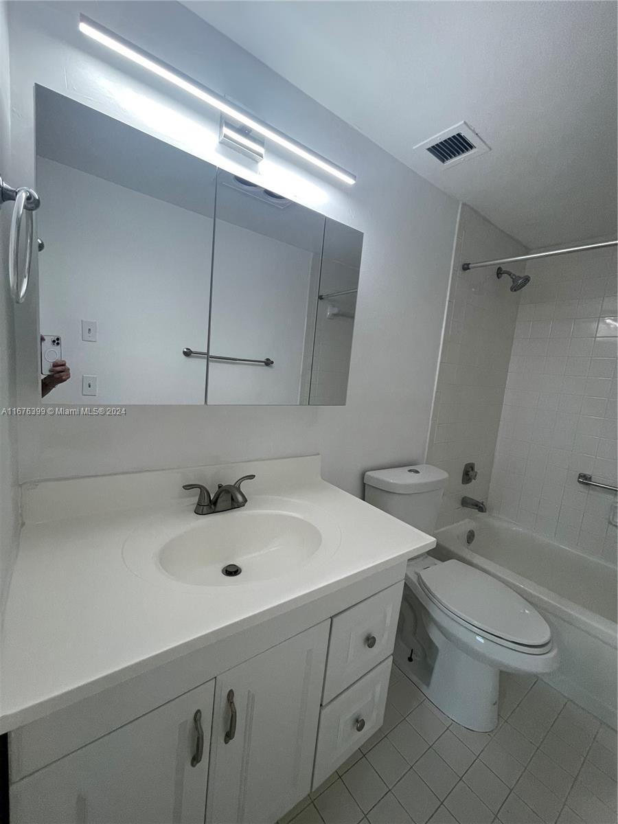 Hillcrest Hollywood, FL 33021 - Photo 14 of 37 a bathroom with a sink a toilet and shower
