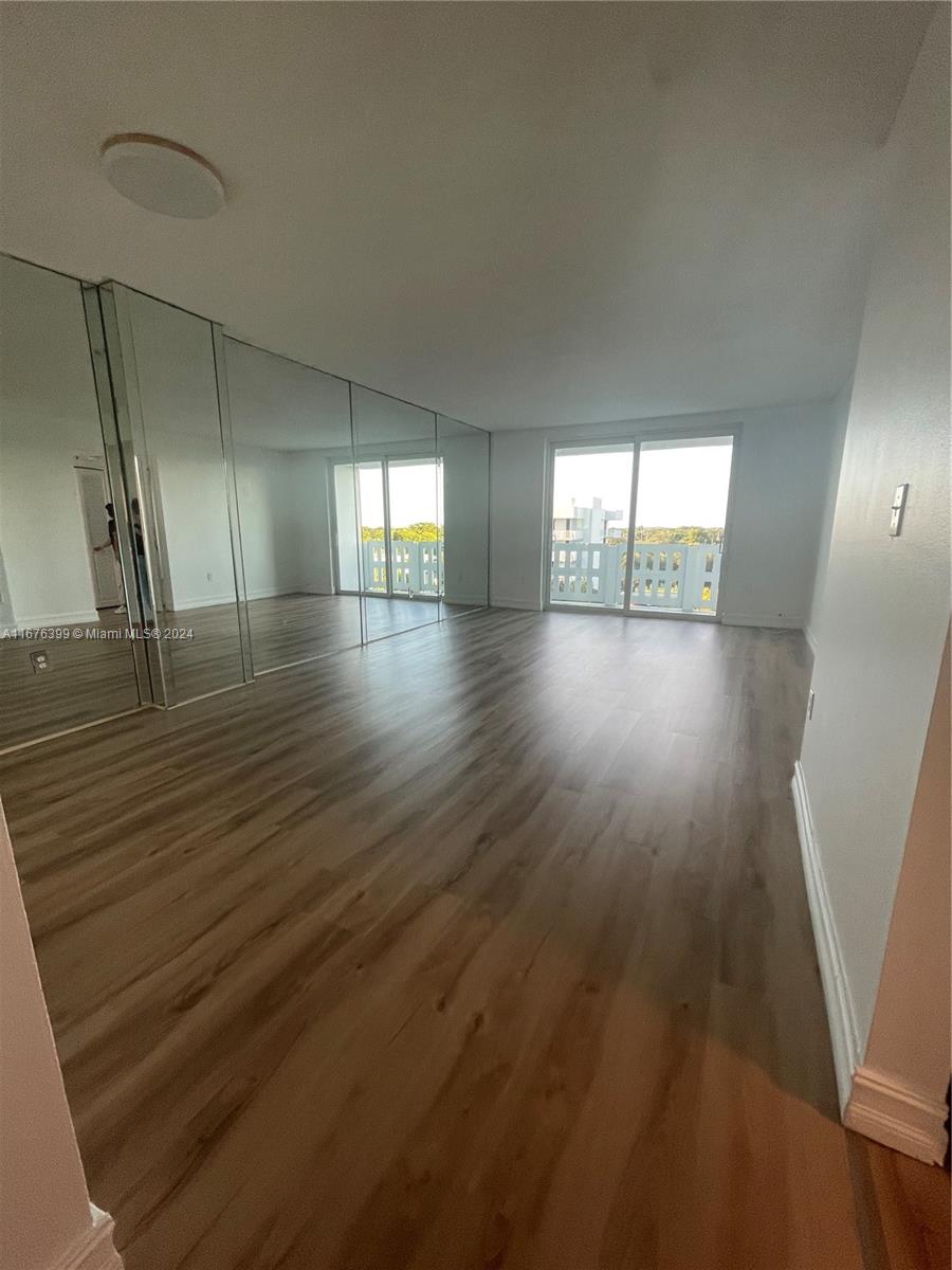 Hillcrest Hollywood, FL 33021 - Photo 2 of 37 an empty room with wooden floor and windows