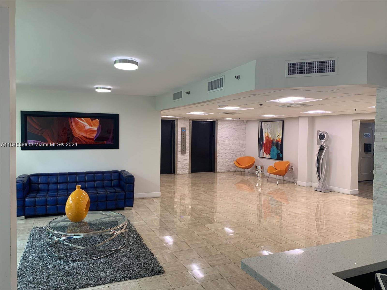 Hillcrest Hollywood, FL 33021 - Photo 21 of 37 a view of living room with furniture and a flat screen tv