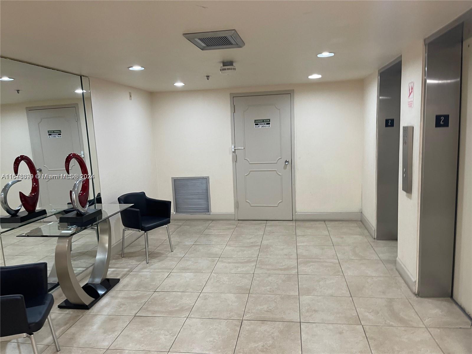 Hillcrest Hollywood, FL 33021 - Photo 25 of 37 a view of a hallway with a chair and dining table