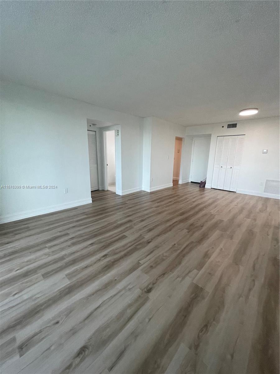 Hillcrest Hollywood, FL 33021 - Photo 4 of 37 a view of an empty room with wooden floor and window