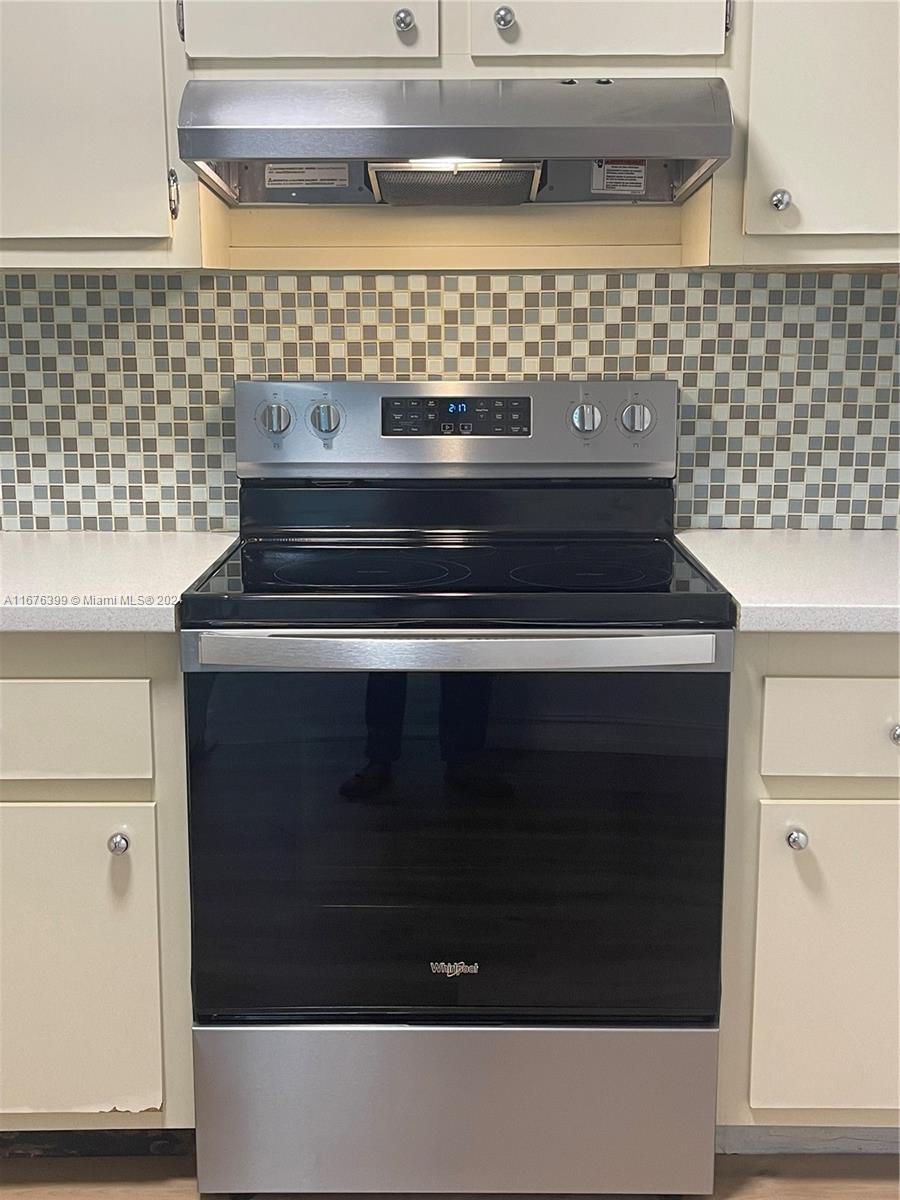 Hillcrest Hollywood, FL 33021 - Photo 10 of 37 a stove top oven sitting inside of a kitchen