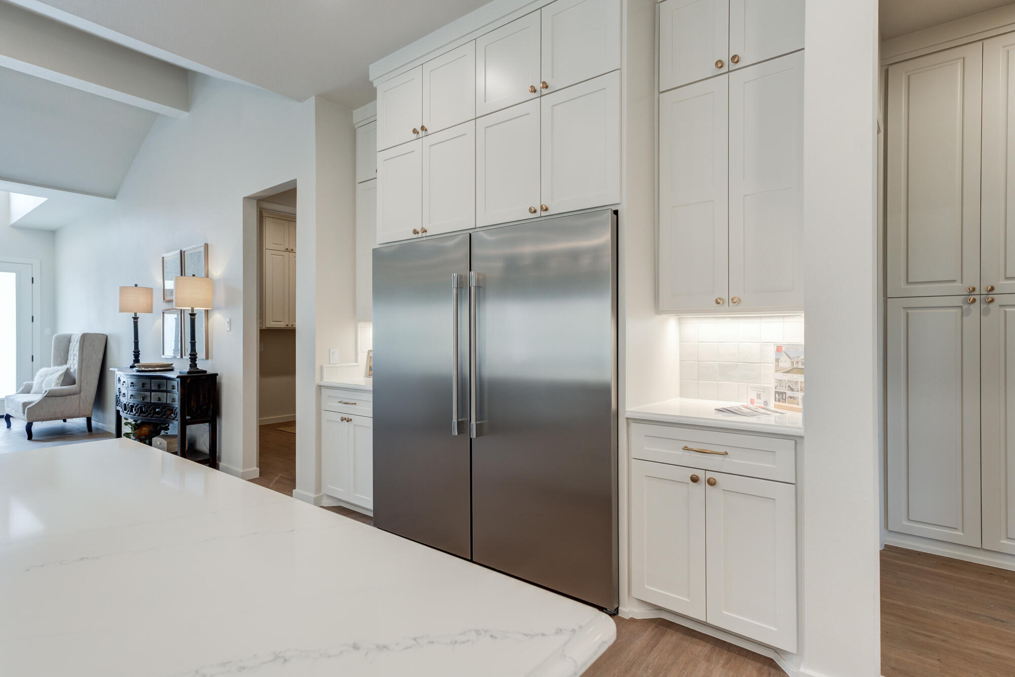 3606 126th Place Lubbock, TX 79423 - Photo 25 of 59 a kitchen with granite countertop a refrigerator and cabinets
