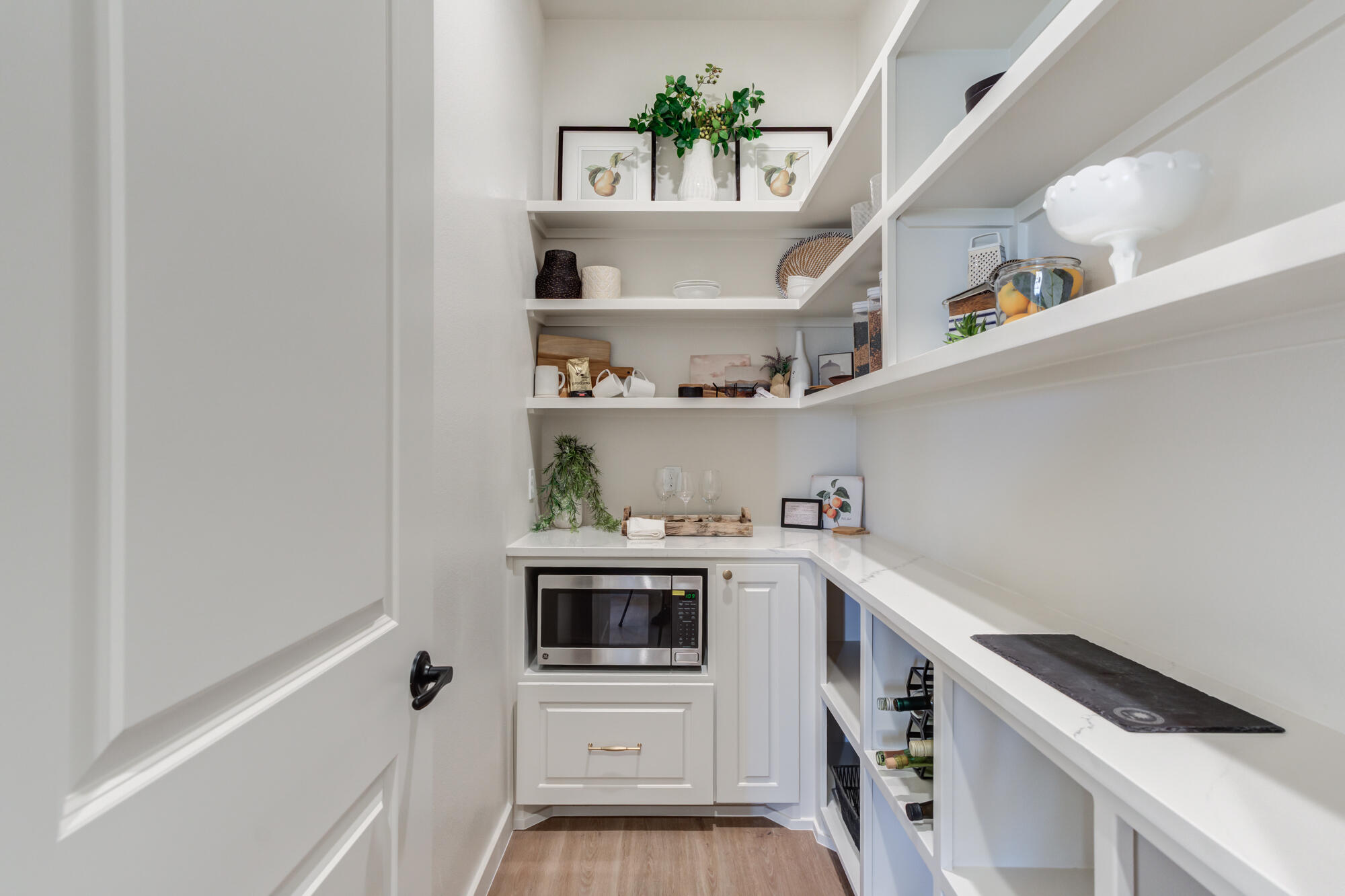 3606 126th Place Lubbock, TX 79423 - Photo 26 of 59 a kitchen with a cabinets and white appliances