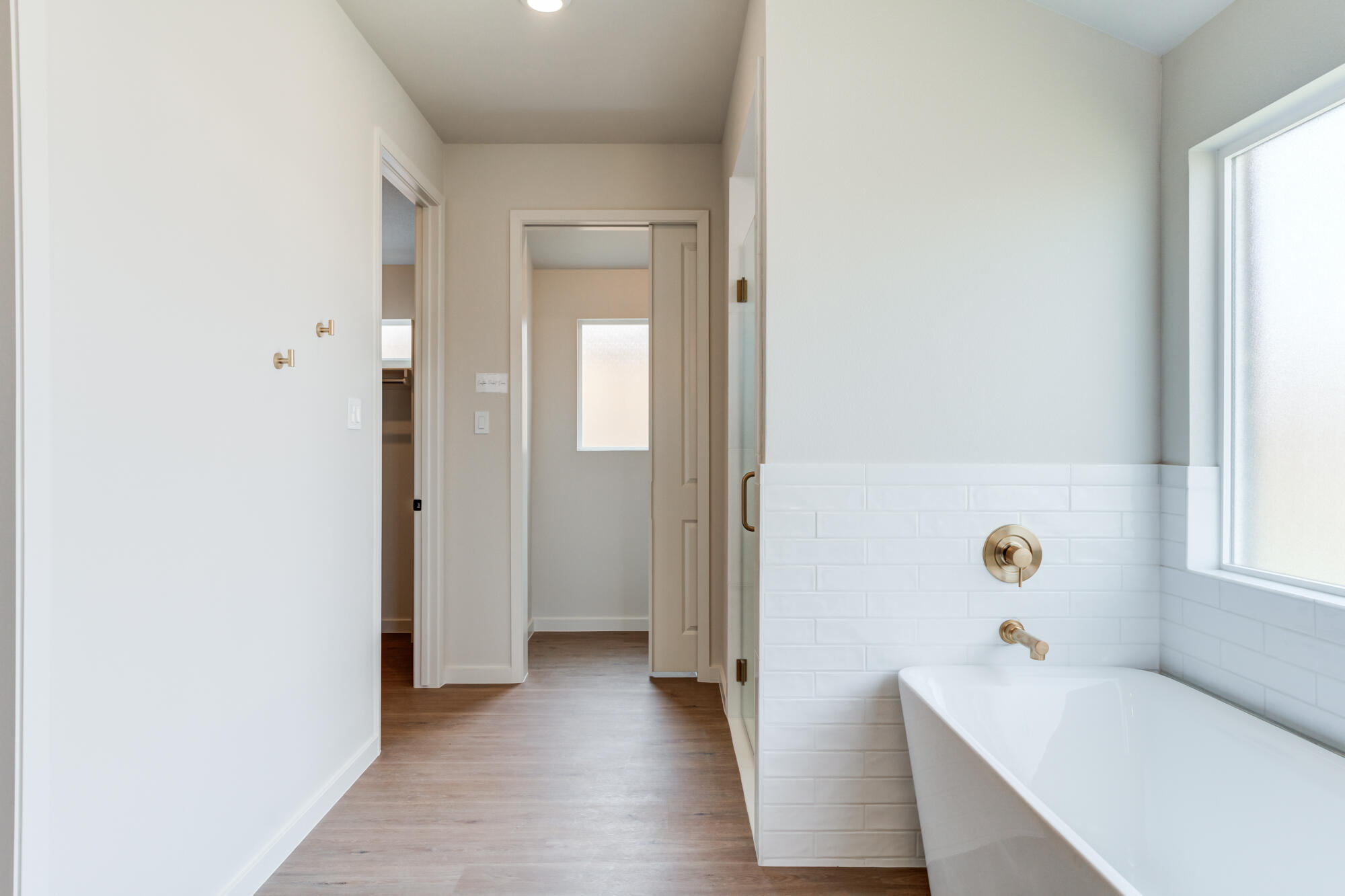 3606 126th Place Lubbock, TX 79423 - Photo 36 of 59 a hallway with windows and wooden floor