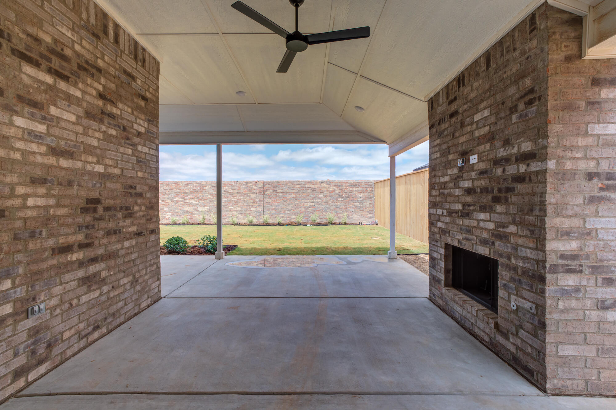 3606 126th Place Lubbock, TX 79423 - Photo 54 of 59 a view of an empty room with a fireplace and a window