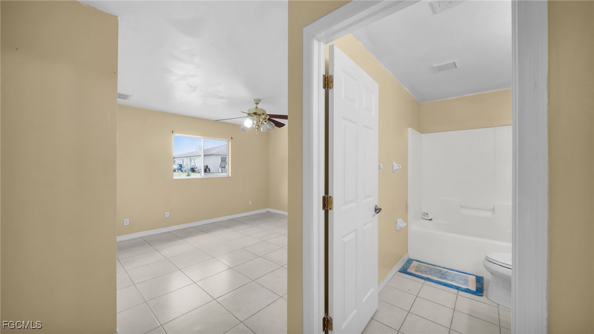 4551 22nd Street Southwest Lehigh Acres, FL 33973 - Photo 11 of 26 wooden floor in a gallery