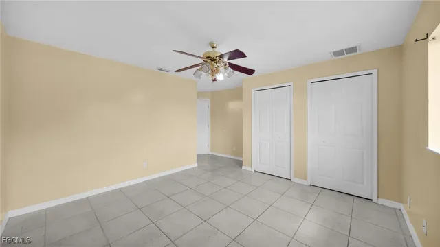 a front view of house with a garden