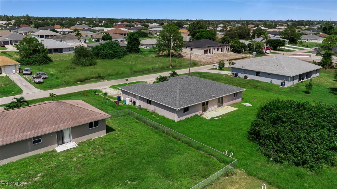 4551 22nd Street Southwest Lehigh Acres, FL 33973 - Photo 23 of 26 an aerial view of a house