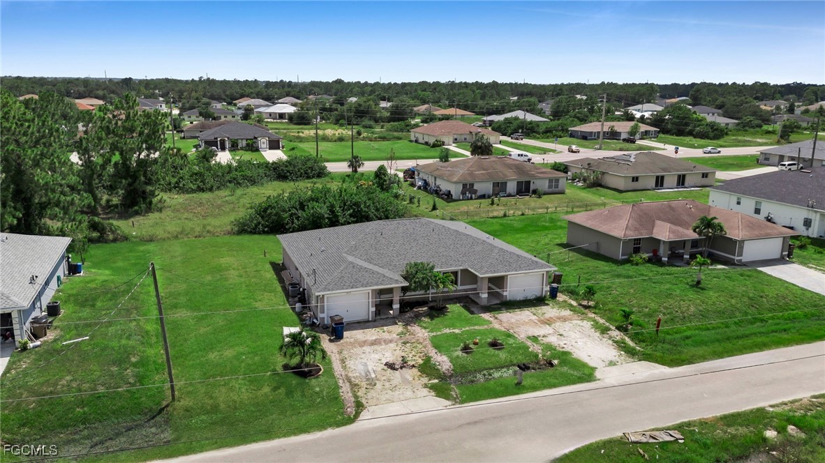 4551 22nd Street Southwest Lehigh Acres, FL 33973 - Photo 24 of 26 an aerial view of a house with garden