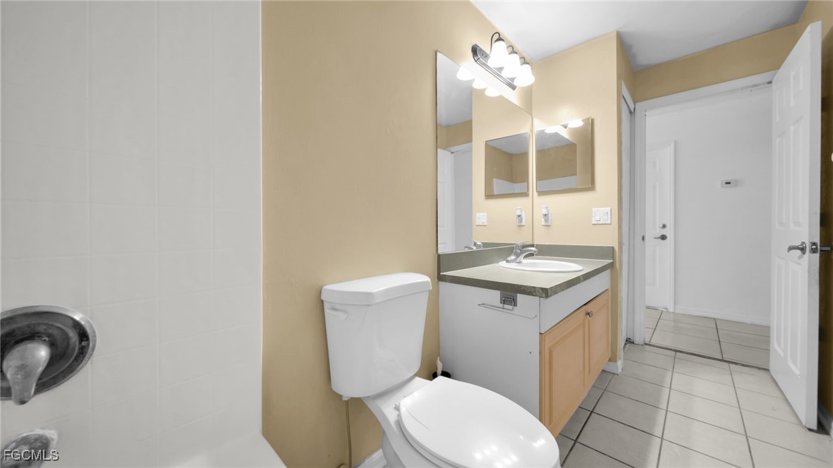 4551 22nd Street Southwest Lehigh Acres, FL 33973 - Photo 3 of 26 a bathroom with a sink toilet and shower