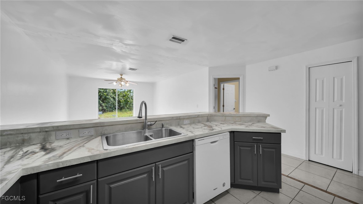 4551 22nd Street Southwest Lehigh Acres, FL 33973 - Photo 10 of 26 a view with two sink and a window
