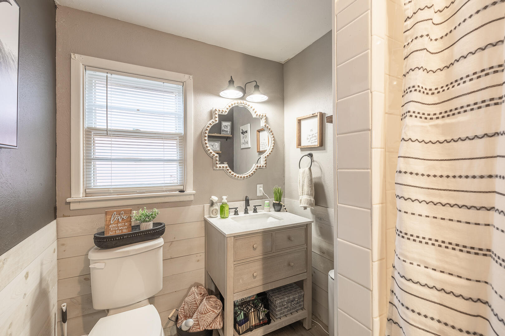 710 West 5th Street Post, TX 79356 - Photo 11 of 50 a bathroom with a sink a toilet and a mirror