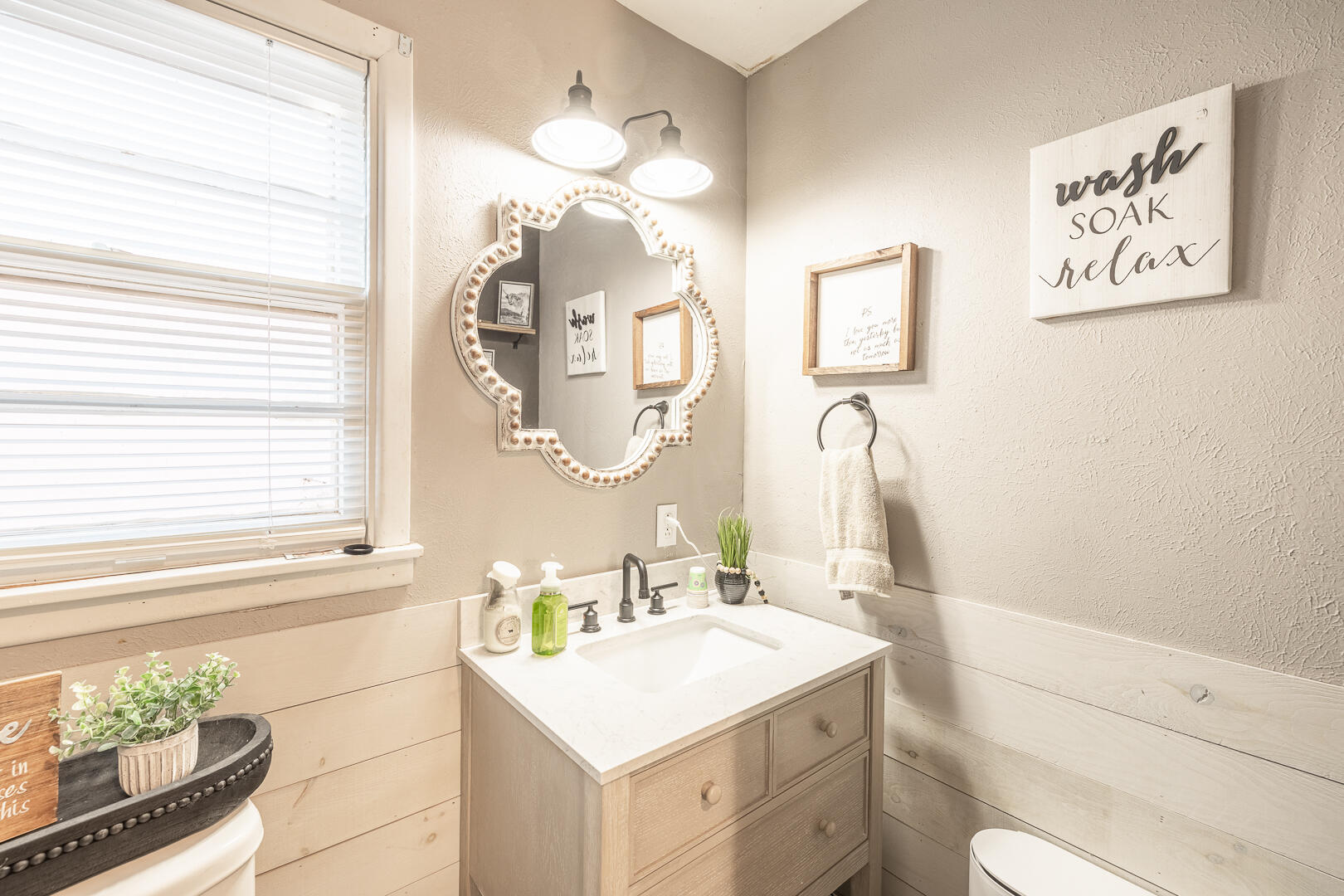 710 West 5th Street Post, TX 79356 - Photo 12 of 50 a bathroom with a sink a toilet and a mirror