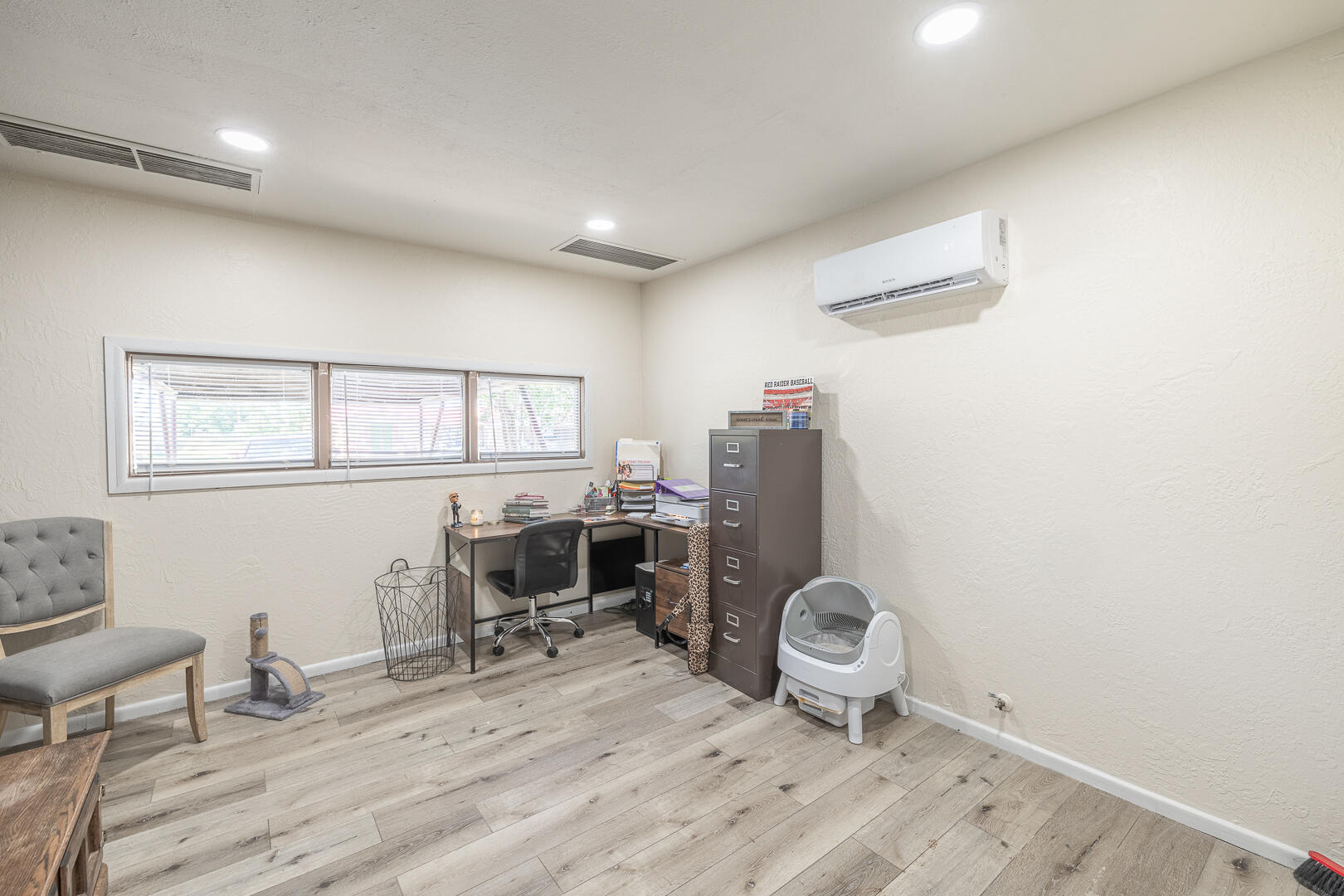 710 West 5th Street Post, TX 79356 - Photo 27 of 50 a view of a workspace with furniture and a window
