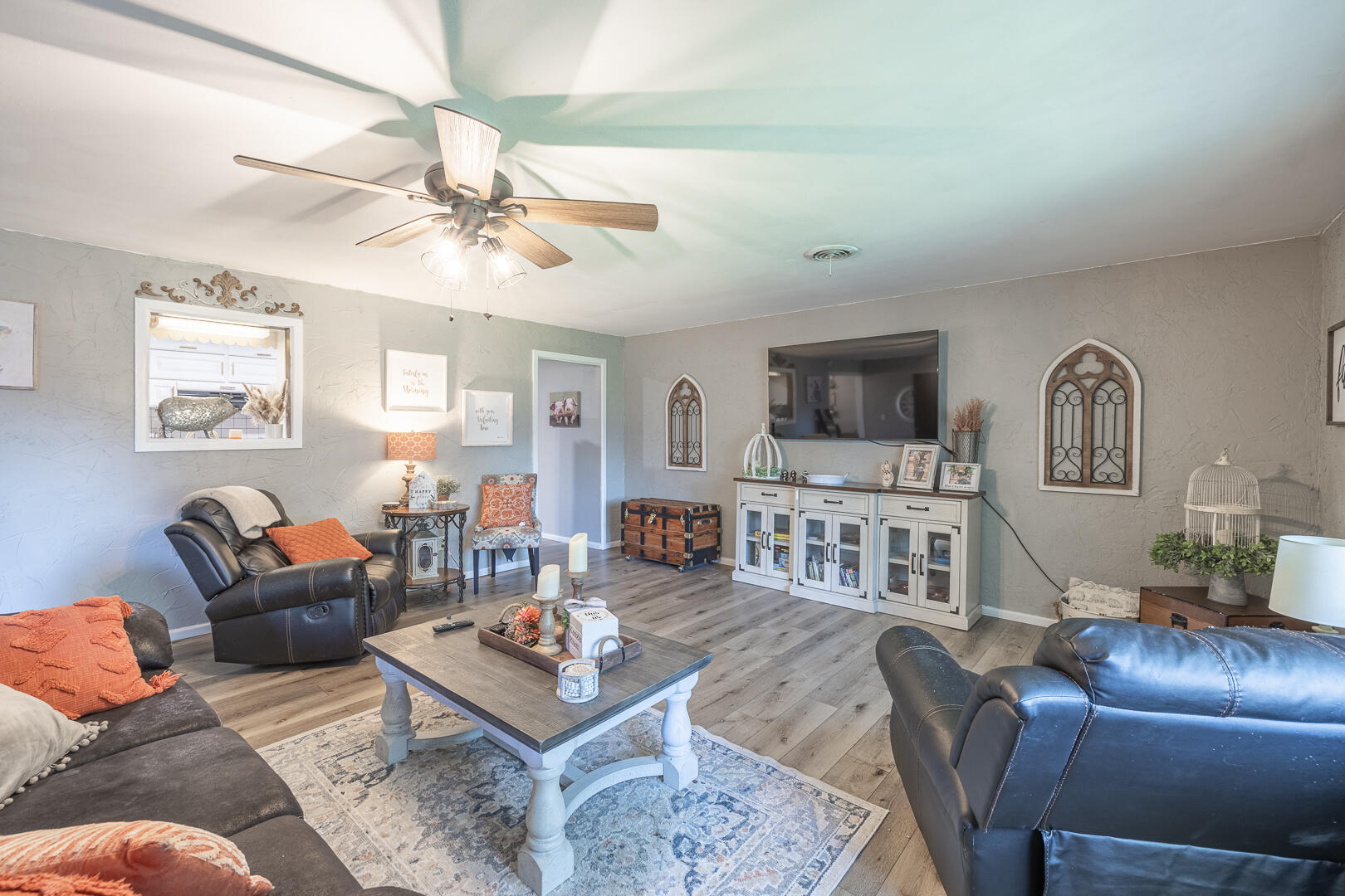 710 West 5th Street Post, TX 79356 - Photo 32 of 50 a living room with furniture a ceiling fan and a rug
