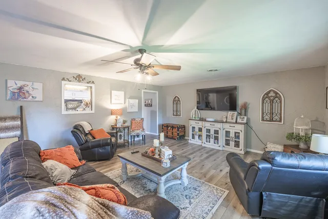a view of a livingroom with furniture and a table