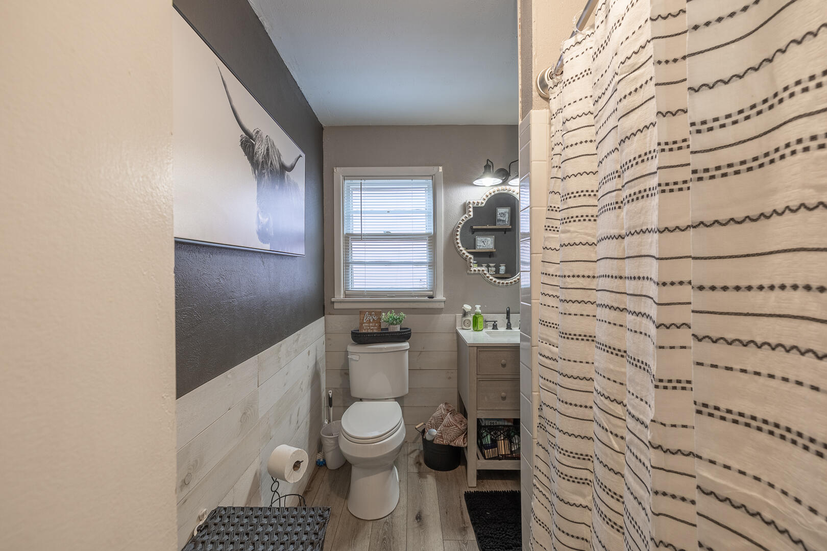 710 West 5th Street Post, TX 79356 - Photo 10 of 50 a bathroom with a toilet and a shower curtain
